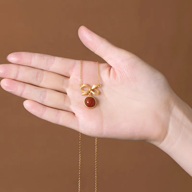 inlaid with southern red tourmaline round bow pendant ladies necklace