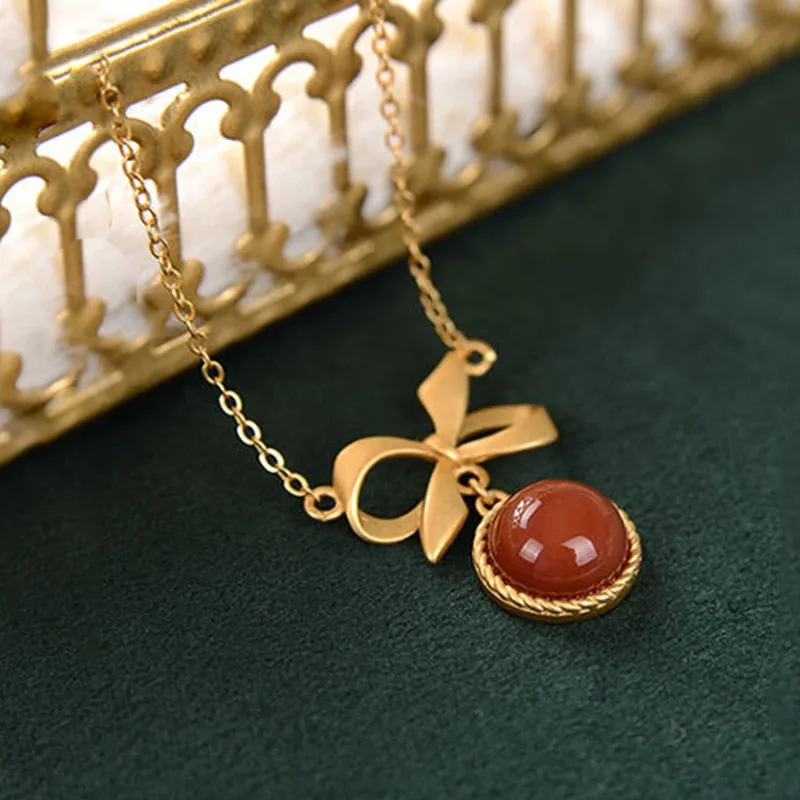 inlaid with southern red tourmaline round bow pendant ladies necklace
