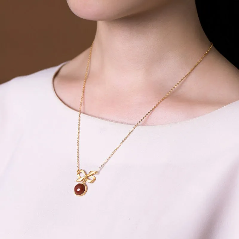 inlaid with southern red tourmaline round bow pendant ladies necklace